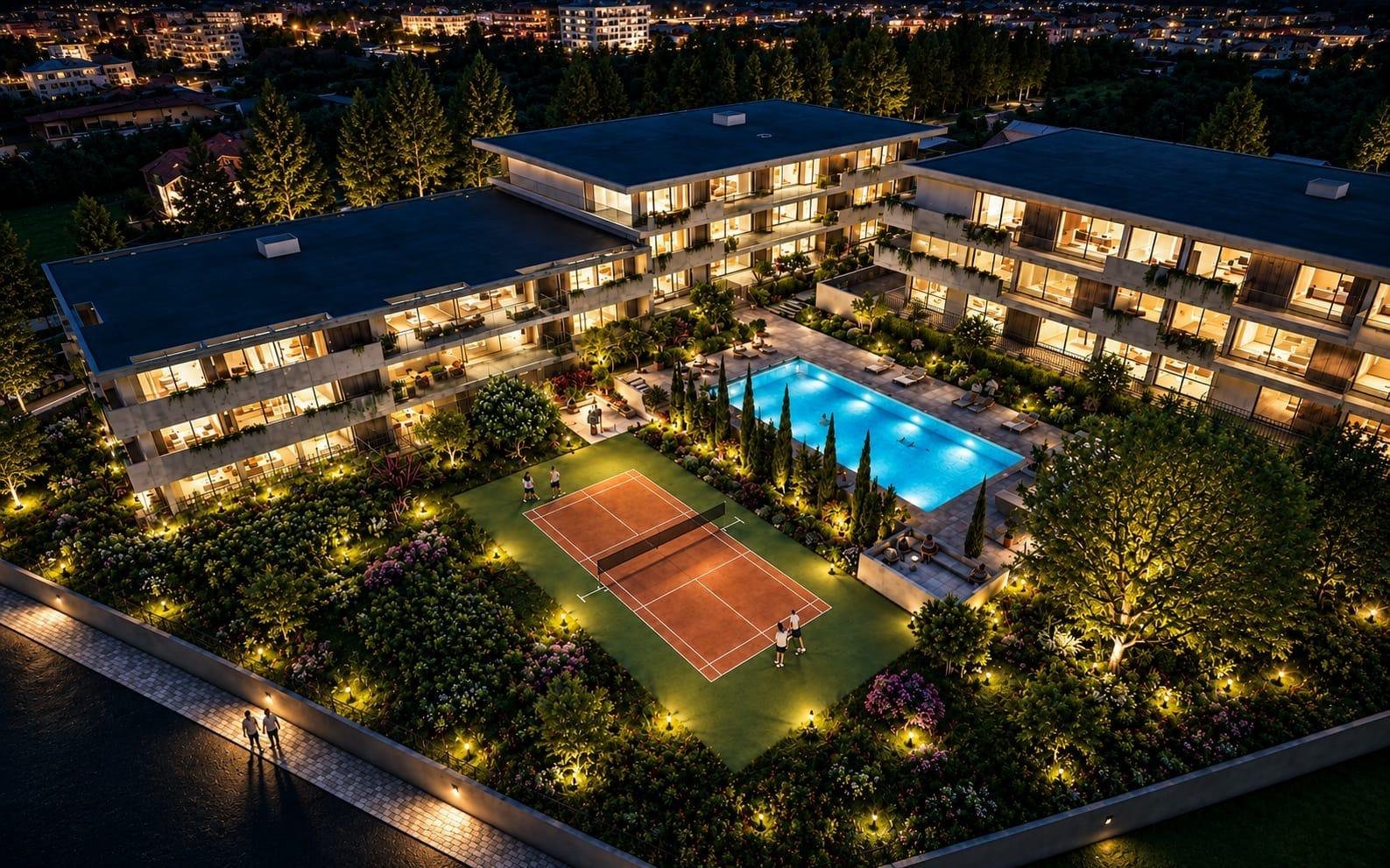 Vista aérea nocturna do conjunto, com a piscina e o campo de padel iluminados