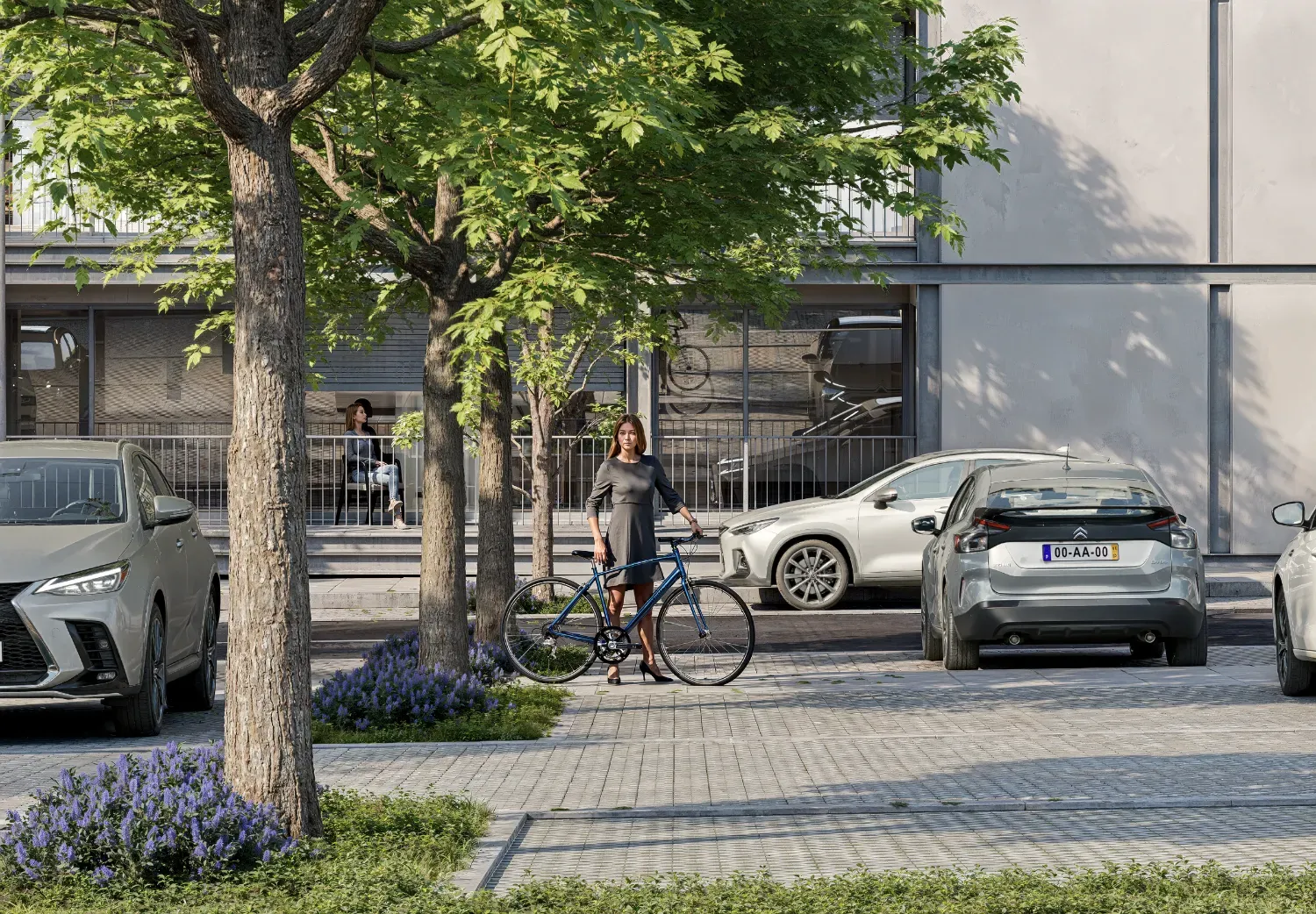 Passeio arborizado em frente ao empreendimento, com bicicleta e estacionamento